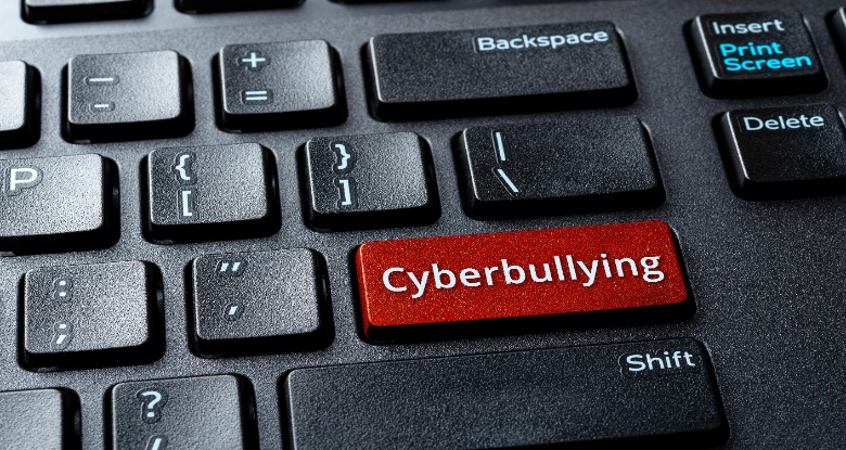 Cyberbully keyboard button on a laptop
