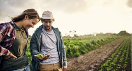 image of farmer showing crop to girl